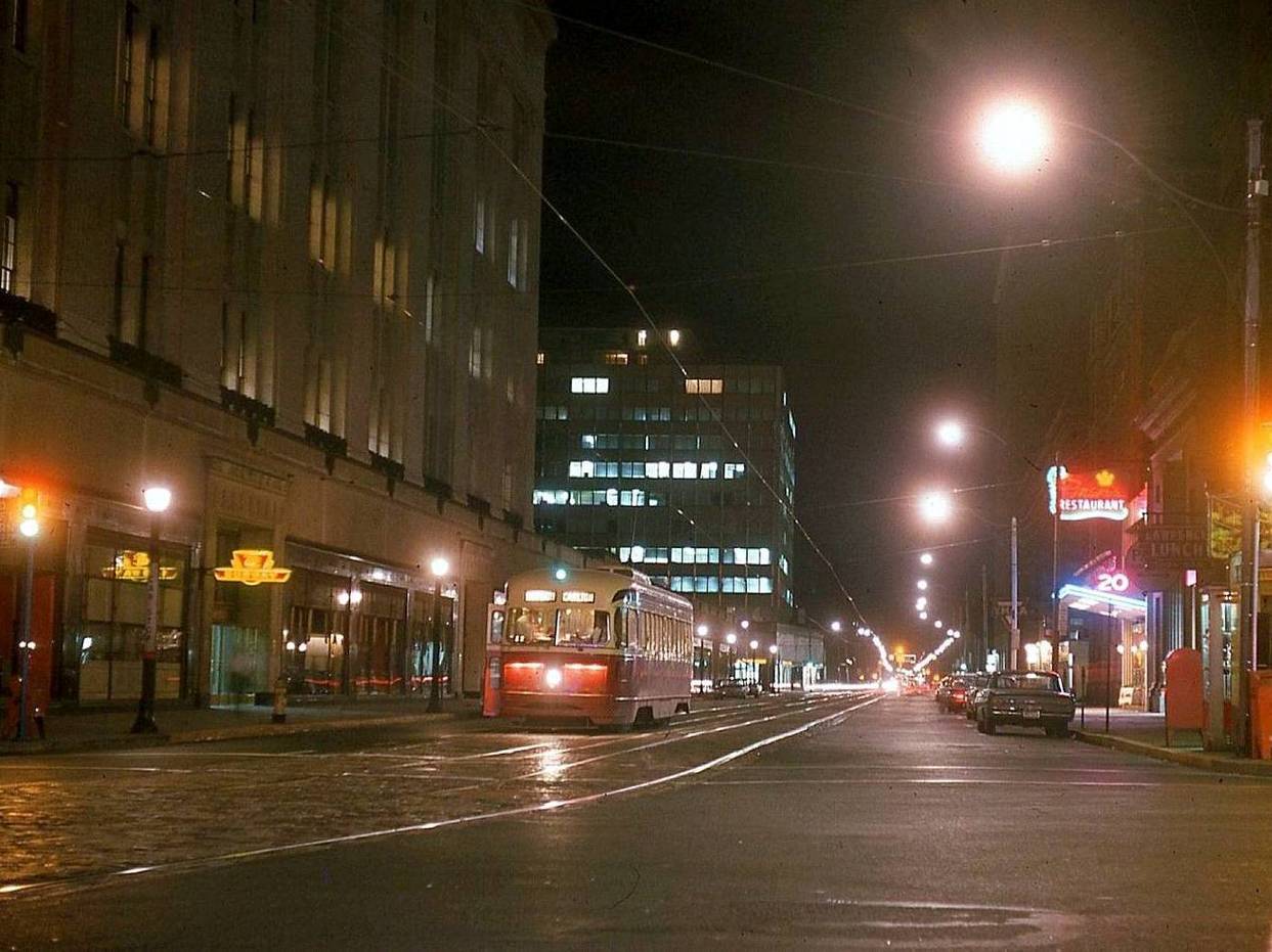 A PHOTO - TORONTO - COLLEGE STREET LOOKING W - NIGHT - PCC STREETCAR APPROACHING YONGE - EATONS ON LEFT - FRAN'S ON RIGHT - 1963