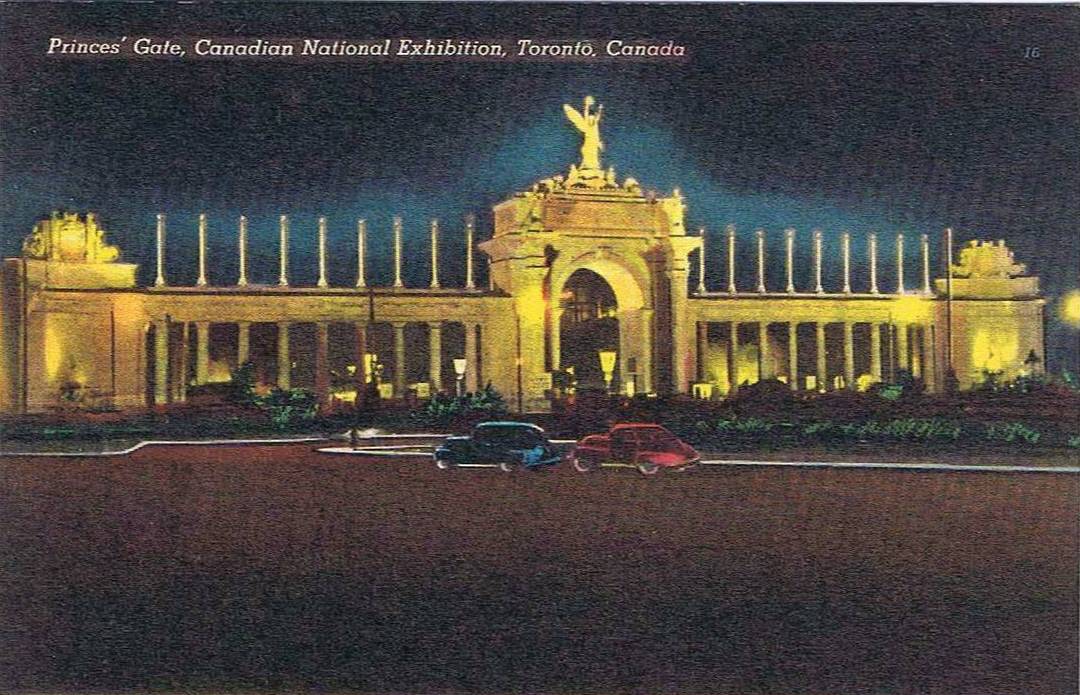 POSTCARD - TORONTO - EXHIBITION - PRINCES' GATE FROM LAKESHORE - LIGHTED AT NIGHT - LOOKING W GROUND LEVEL - ATMOSPHERIC - TINTED - NICE VERSION - c1940