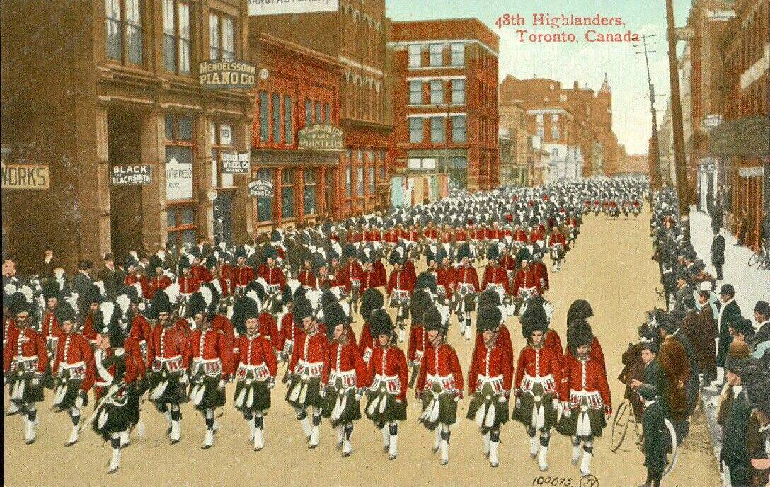 POSTCARD - TORONTO - PARADE OF 48TH HIGHLANDERS - SLIGHTLY ELEVATED VIEW DOWN THE STREET - PERHAPS ADELAIDE W - TINTED - 1909